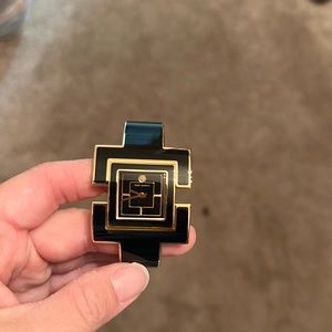 Black and gold Tory Burch watch new without tags. Never worn needs a new battery